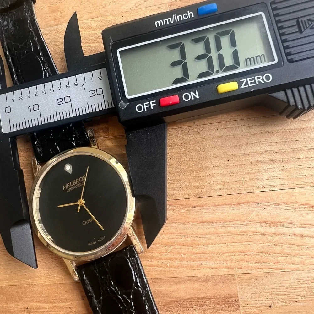 Helbros invincible ladies gold tone and black dress watch NEW BATTERY